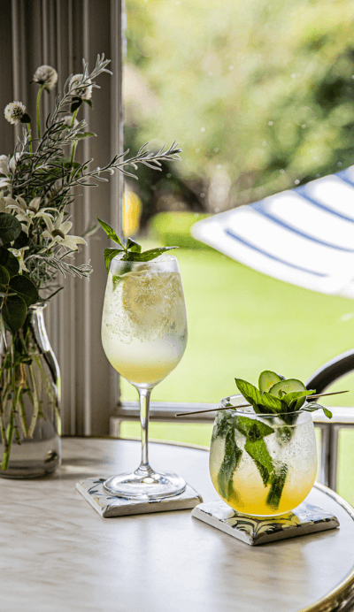 two lush cold drinks at restaurant table