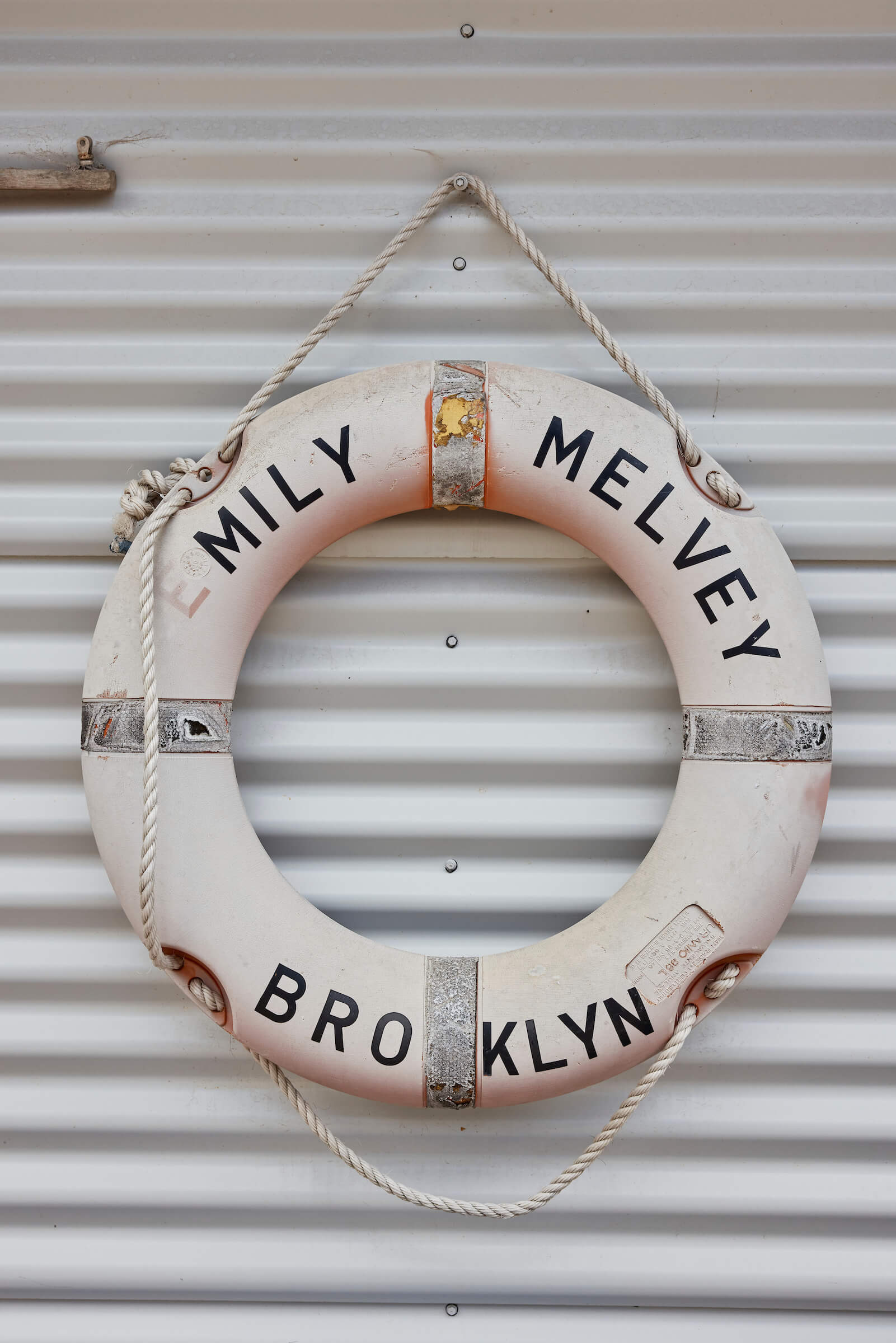 life saving ring from yesteryear hanging on oyster shed