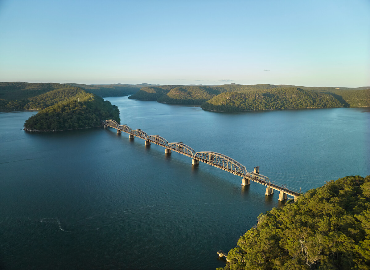 aerial of bridge over hawkesbury river surrounded by greenery