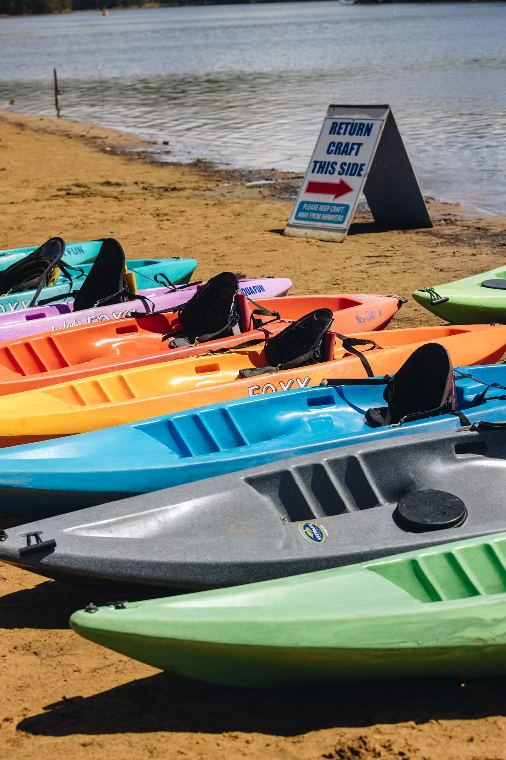 kayaks in a colourful line