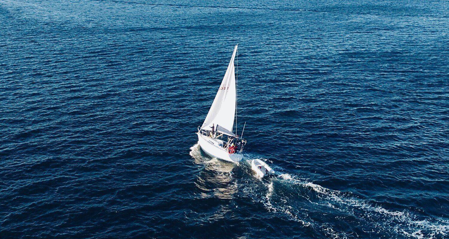 sailing boat on blue lake 