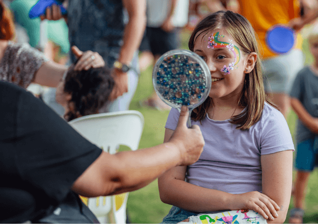 girl having her face painted