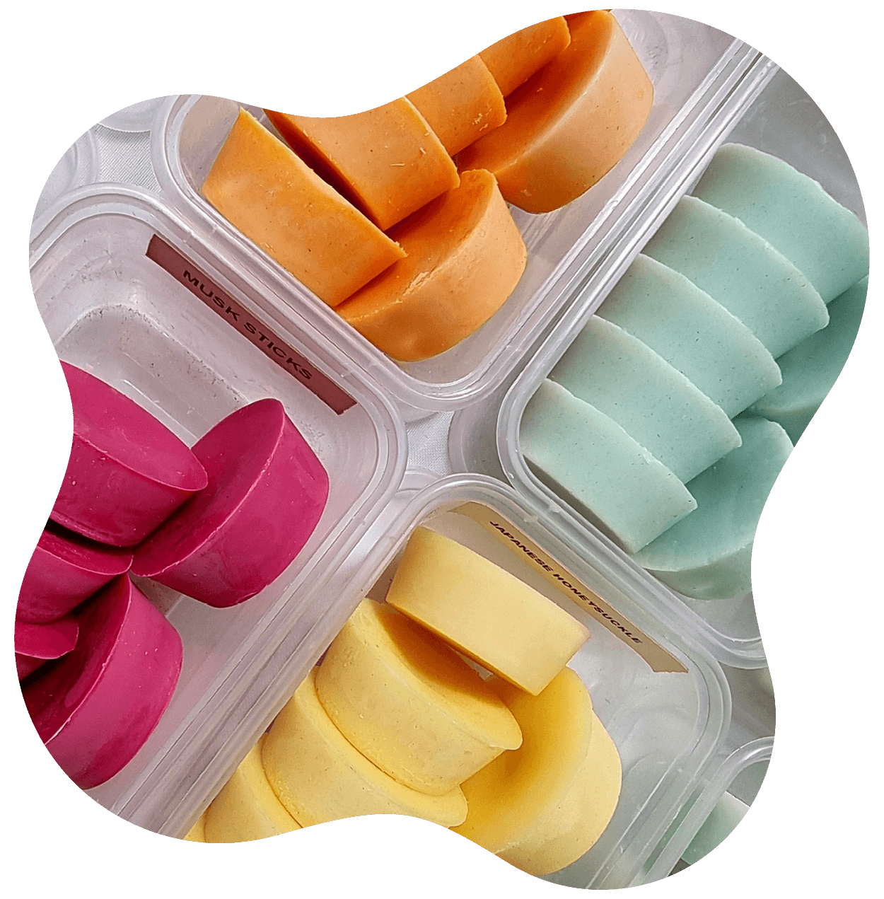 Plastic tubs of colourful blocks of scents 