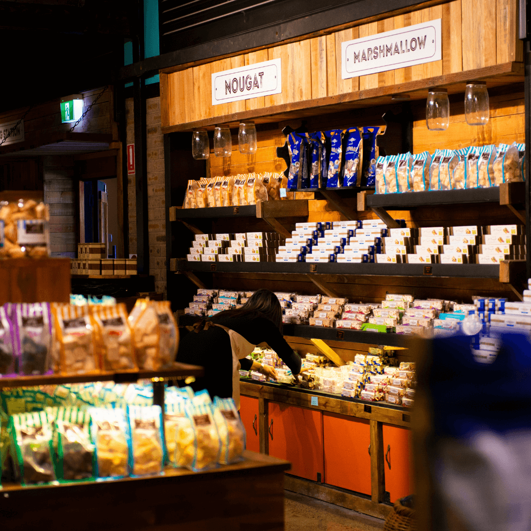 A shop filled with shelves of chocolate