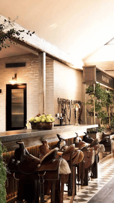 Long view of the bar stools at Saddles