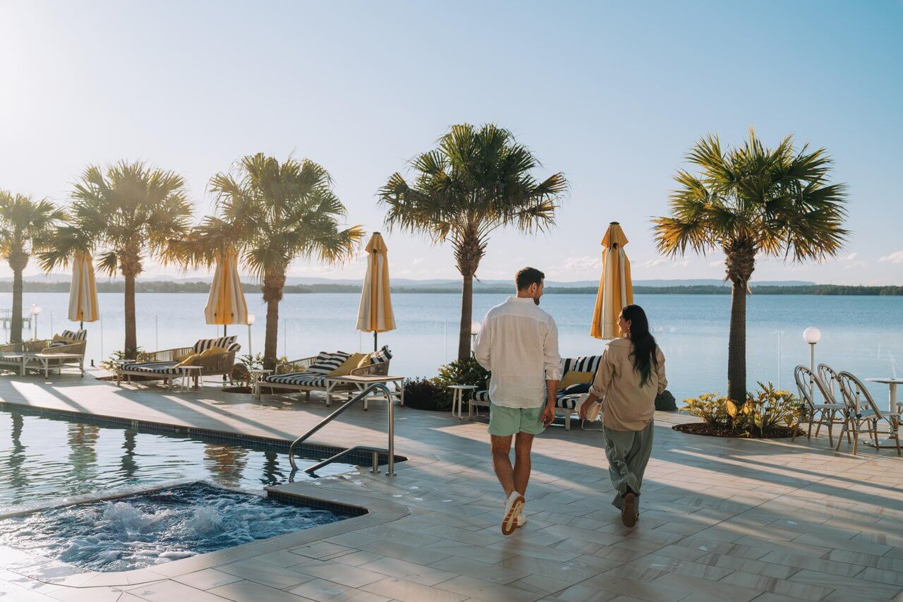 couple at poolside resort in sunshine