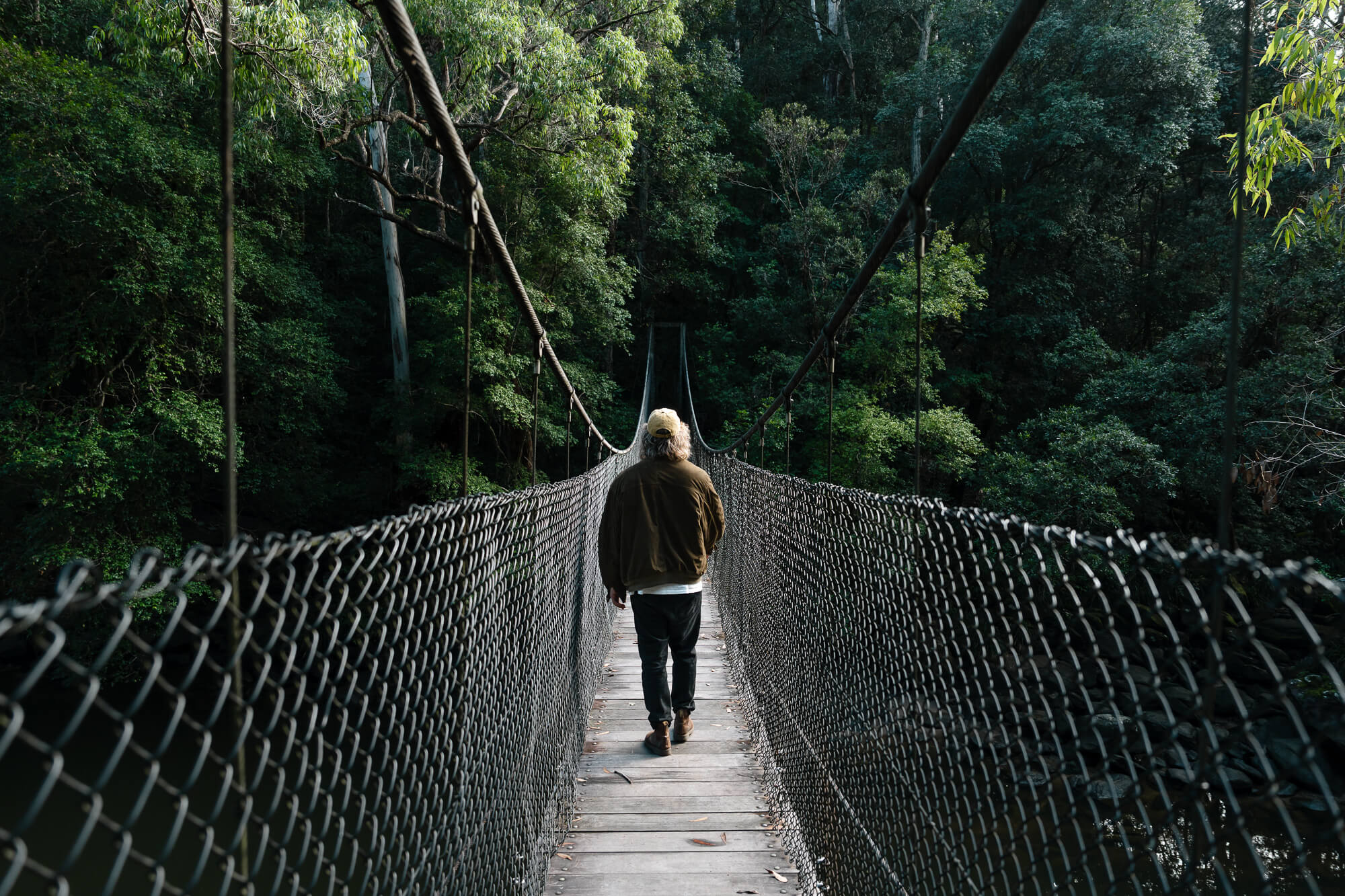 Man crossing bridge at Piles Creek