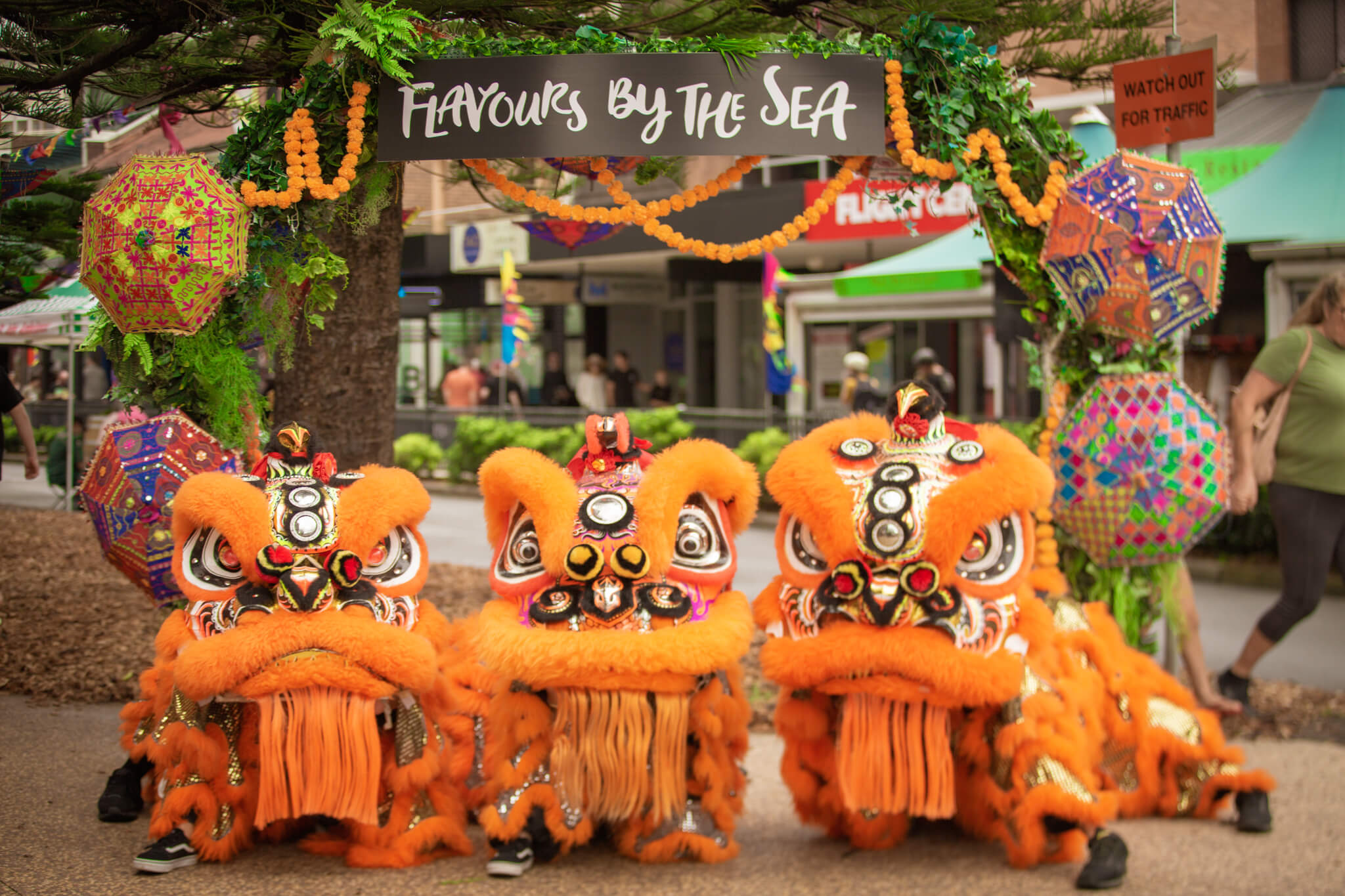 Chinese dragons under Flavours by the Sea banner