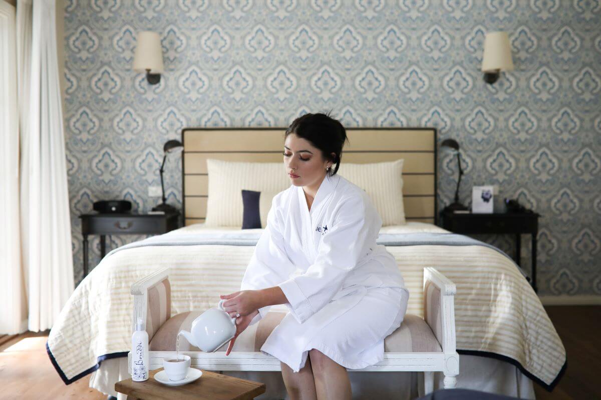 Woman in robe in hotel room