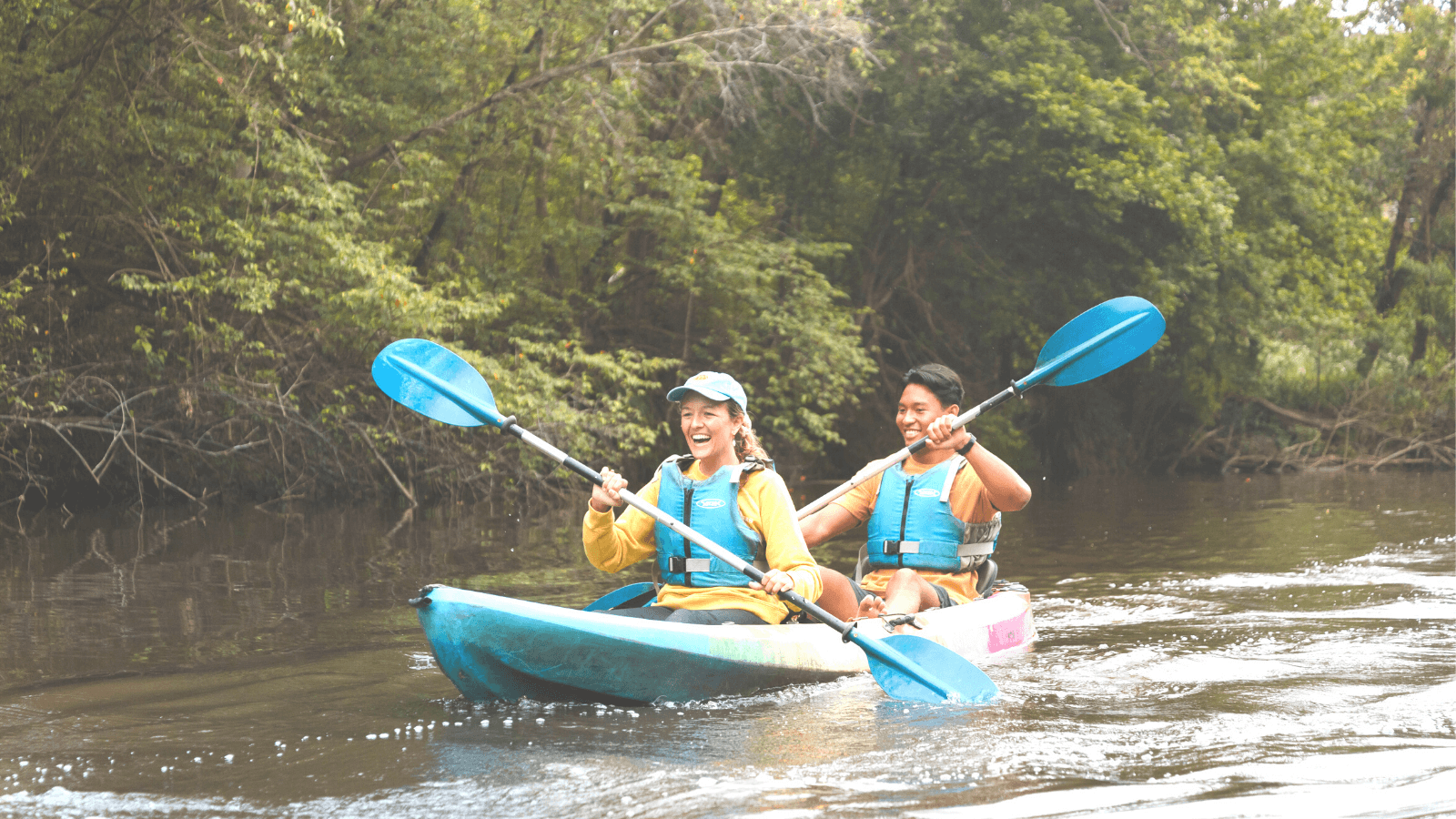 woman and man kayaking on the Central Coast
