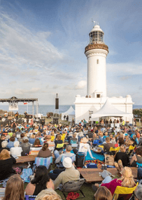 crowd at live music event around norah head lighthouse