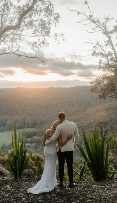 Married couple looking over Australian landscape view on Central Coast
