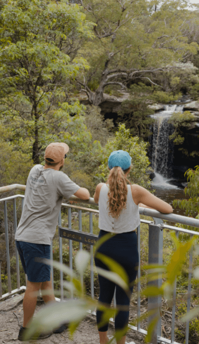couple look at waterfall