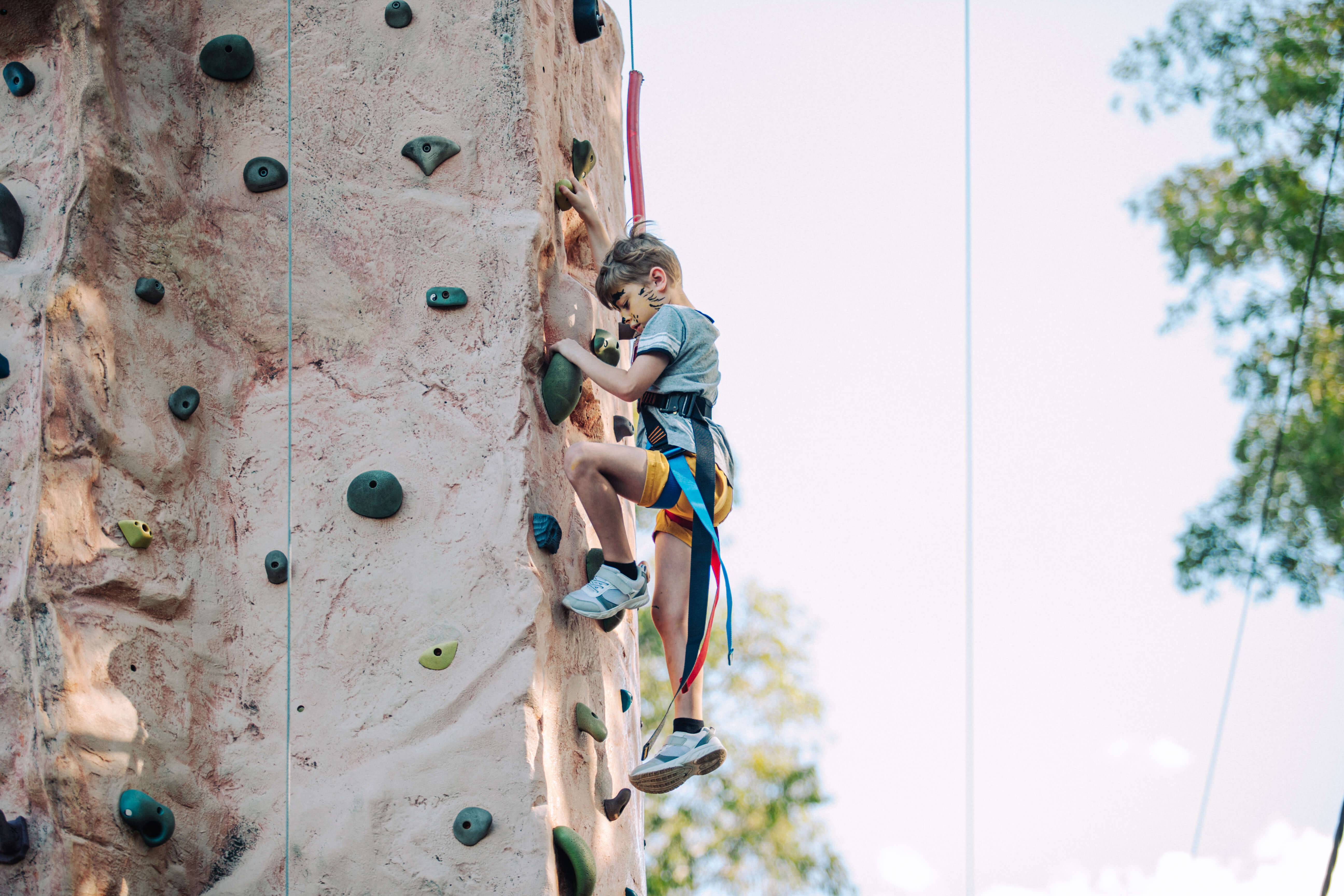 Boy rock climbing