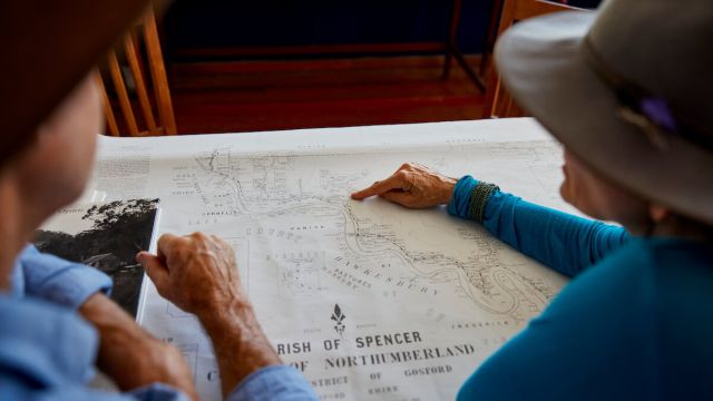 tour guides cast eye over old map detail
