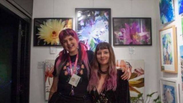Two females in art gallery space