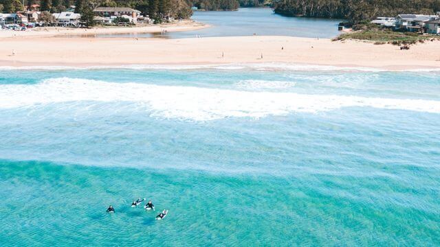 from above lagoon meets blue ocean