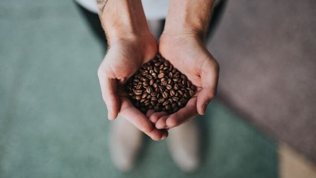 Coffee in the hands of roaster from Looloos Coffee Roasters 