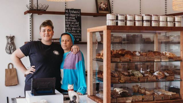 owners stand proud with locally made pastries