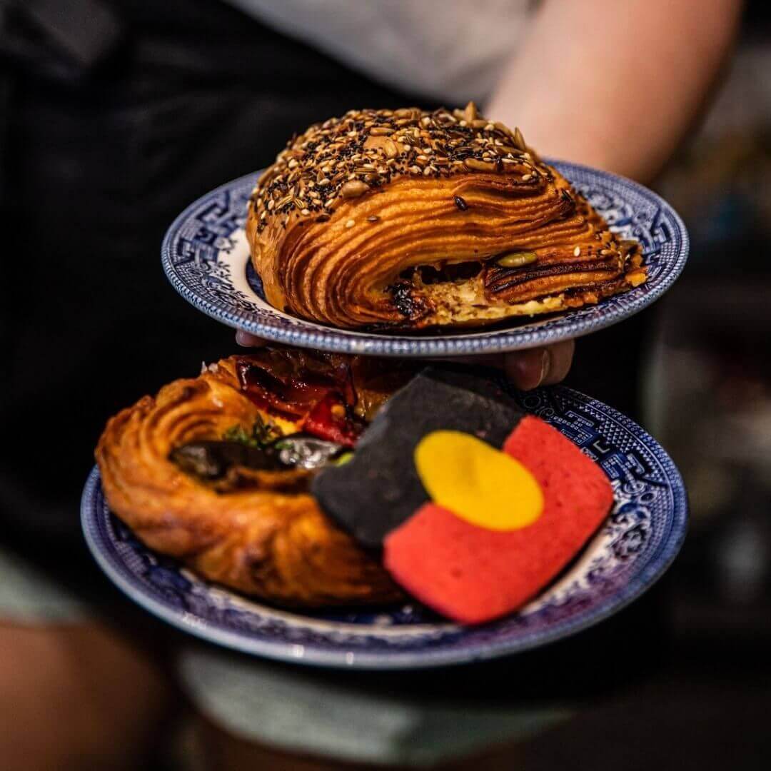 baked pastries including cookie with indigenous flag colours