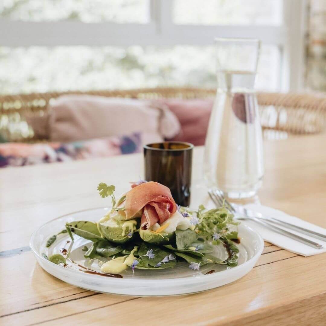 avo smash brunch with water on table