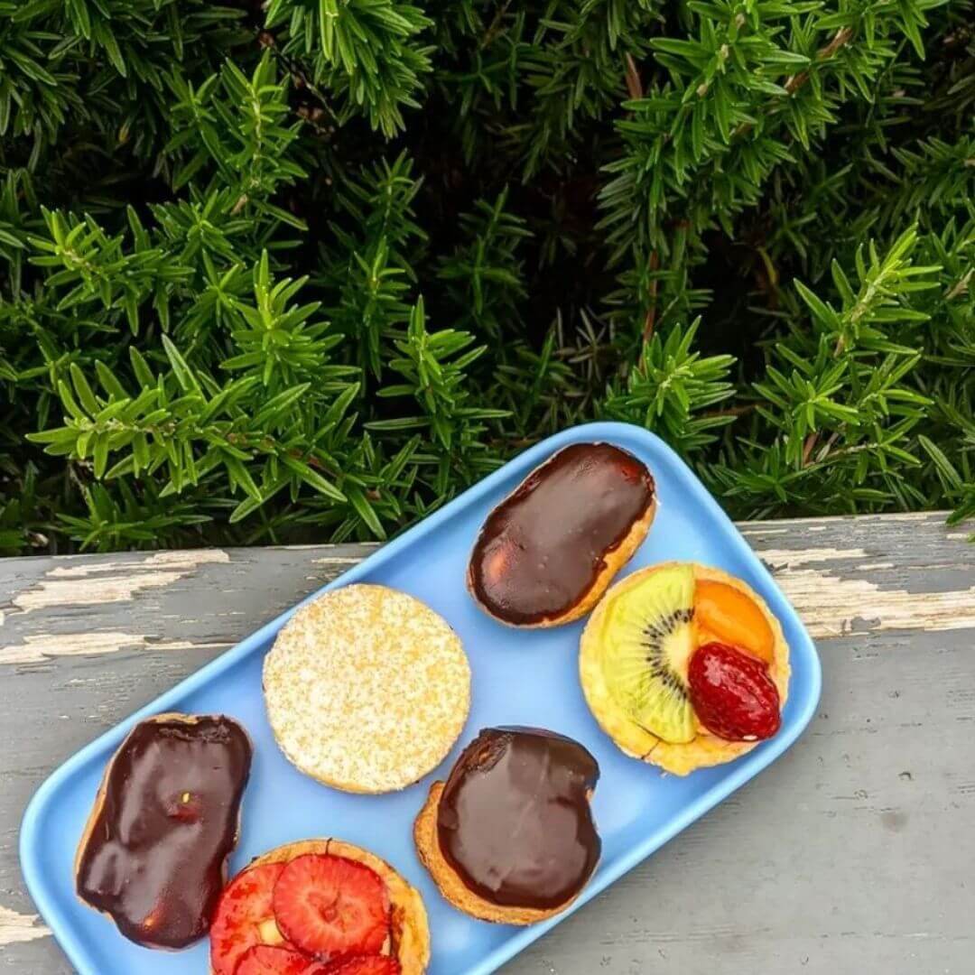 petit four pastries on plate with icing