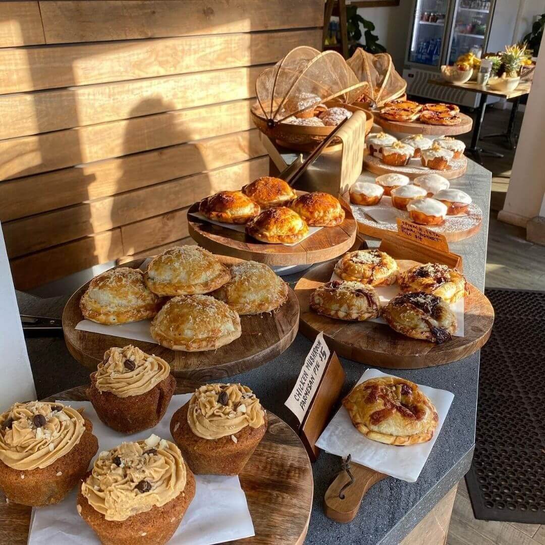 table covered with fresh morning baked savoury items