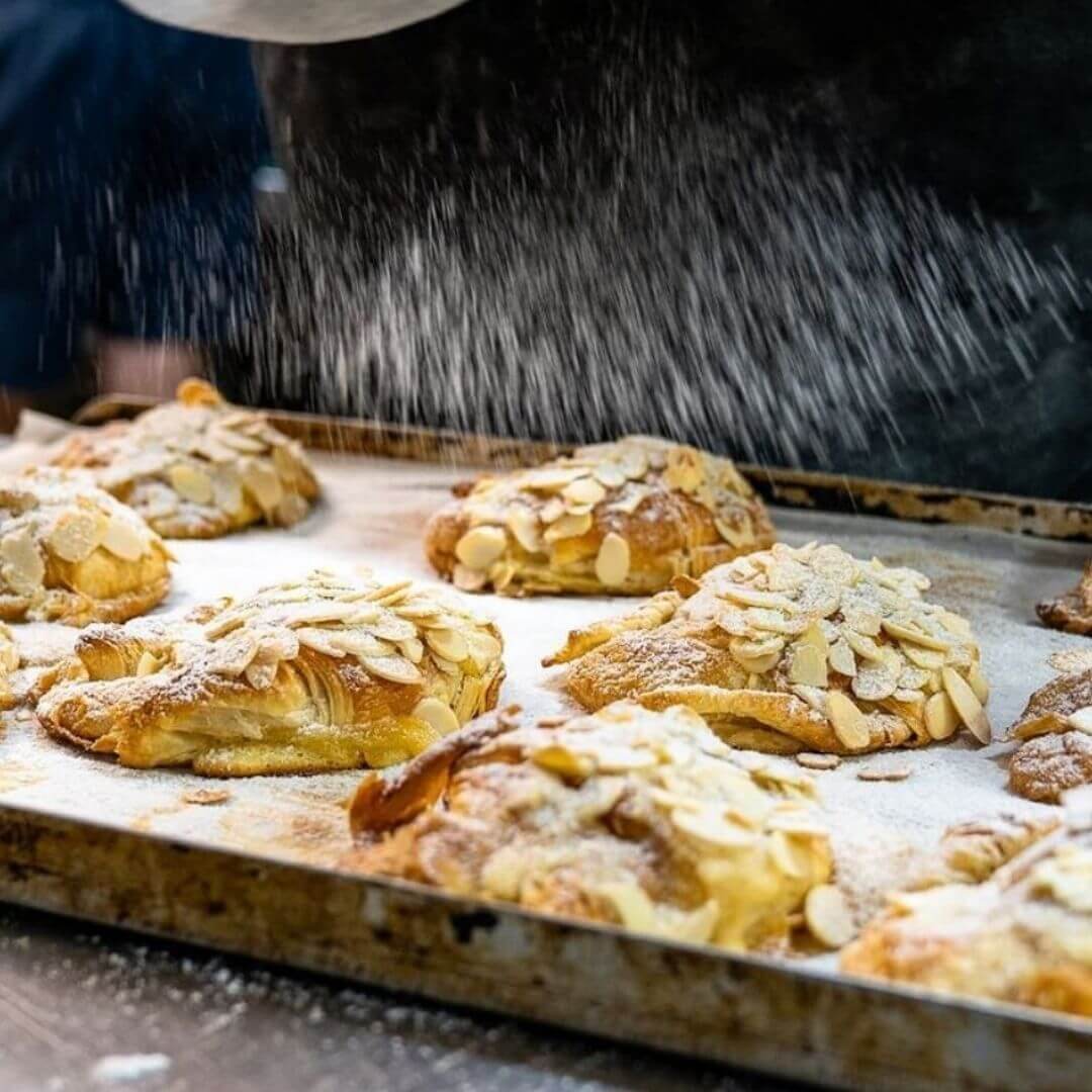 almond croissant with icing dusting