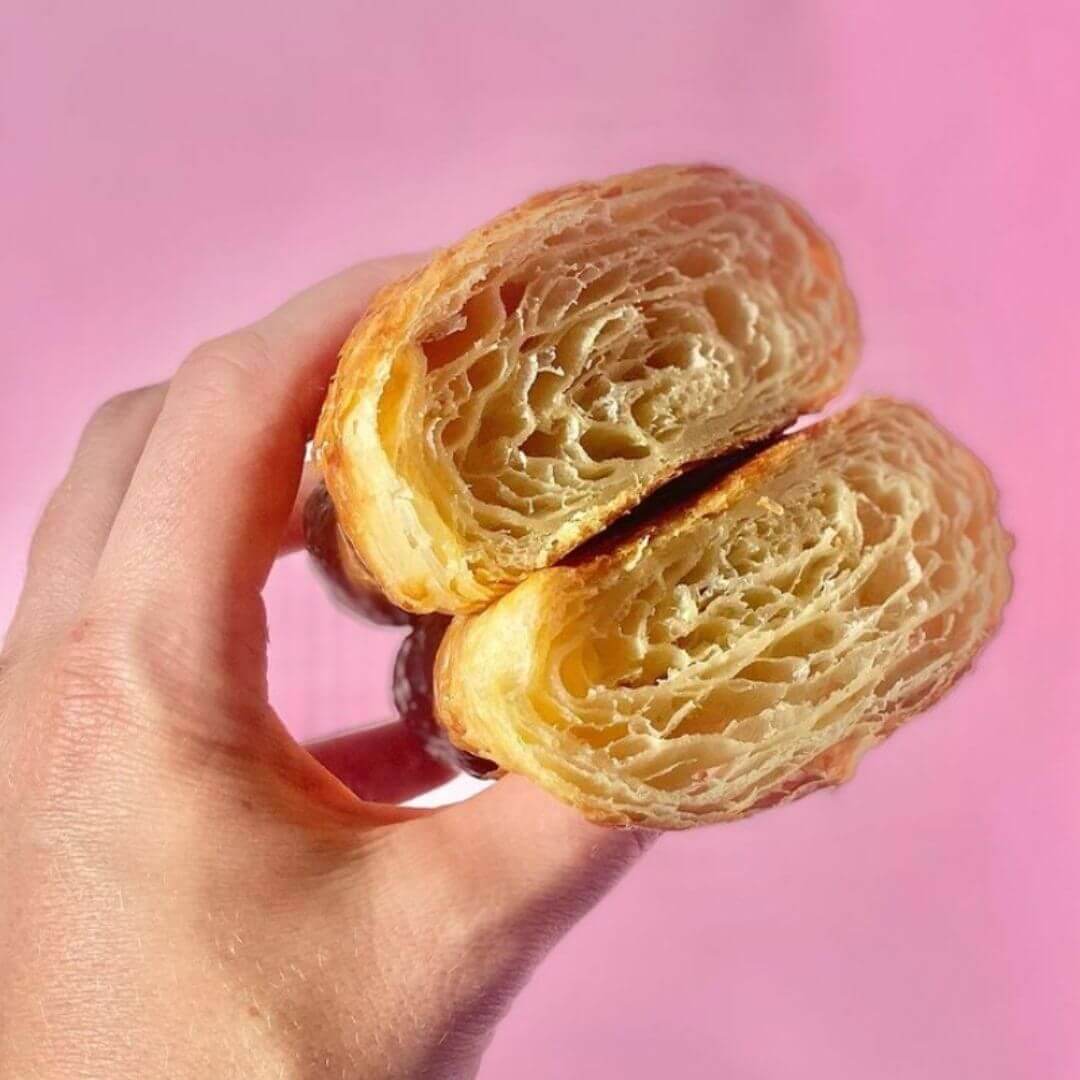 hand holding impressive layered pastry