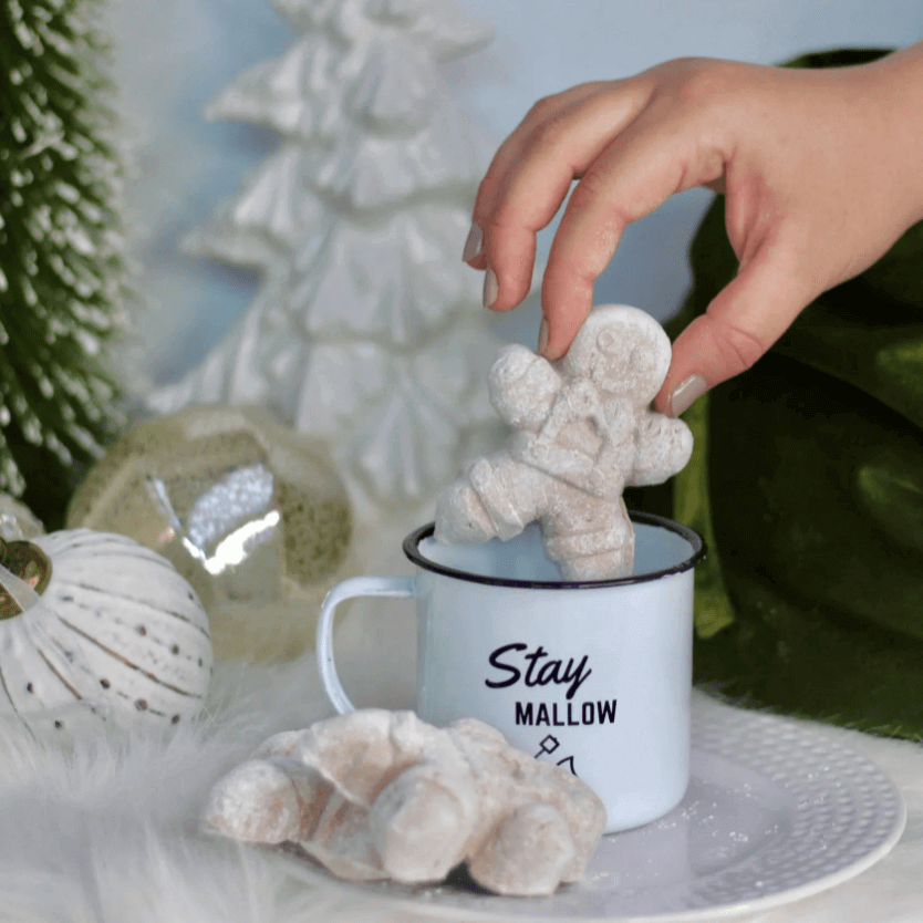 marshmallow dunked in hot chocolate