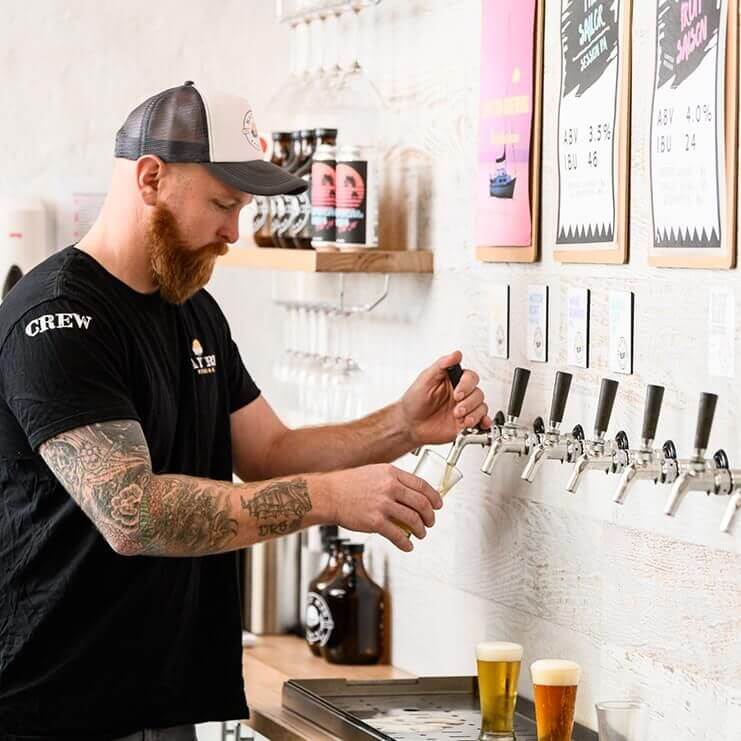 fresh draught beer poured by bartender