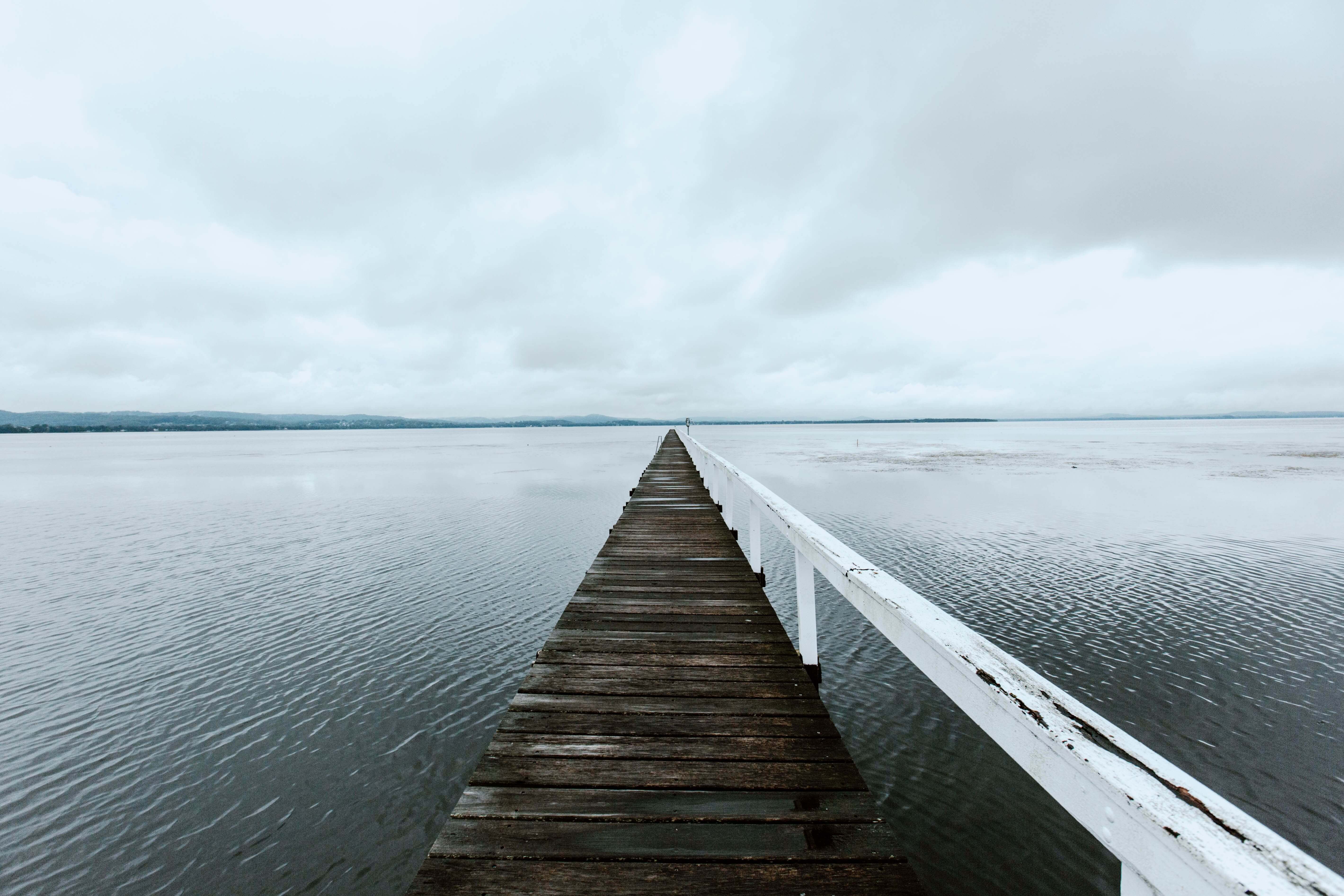 a very long jetty in the mist