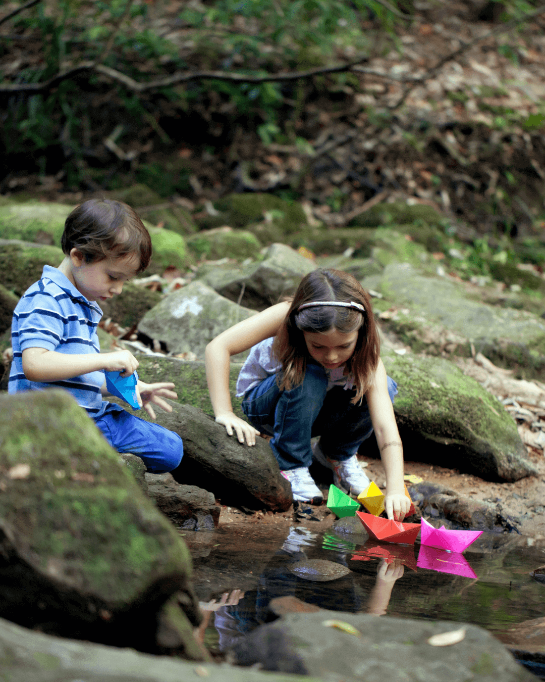kids play in forest pond