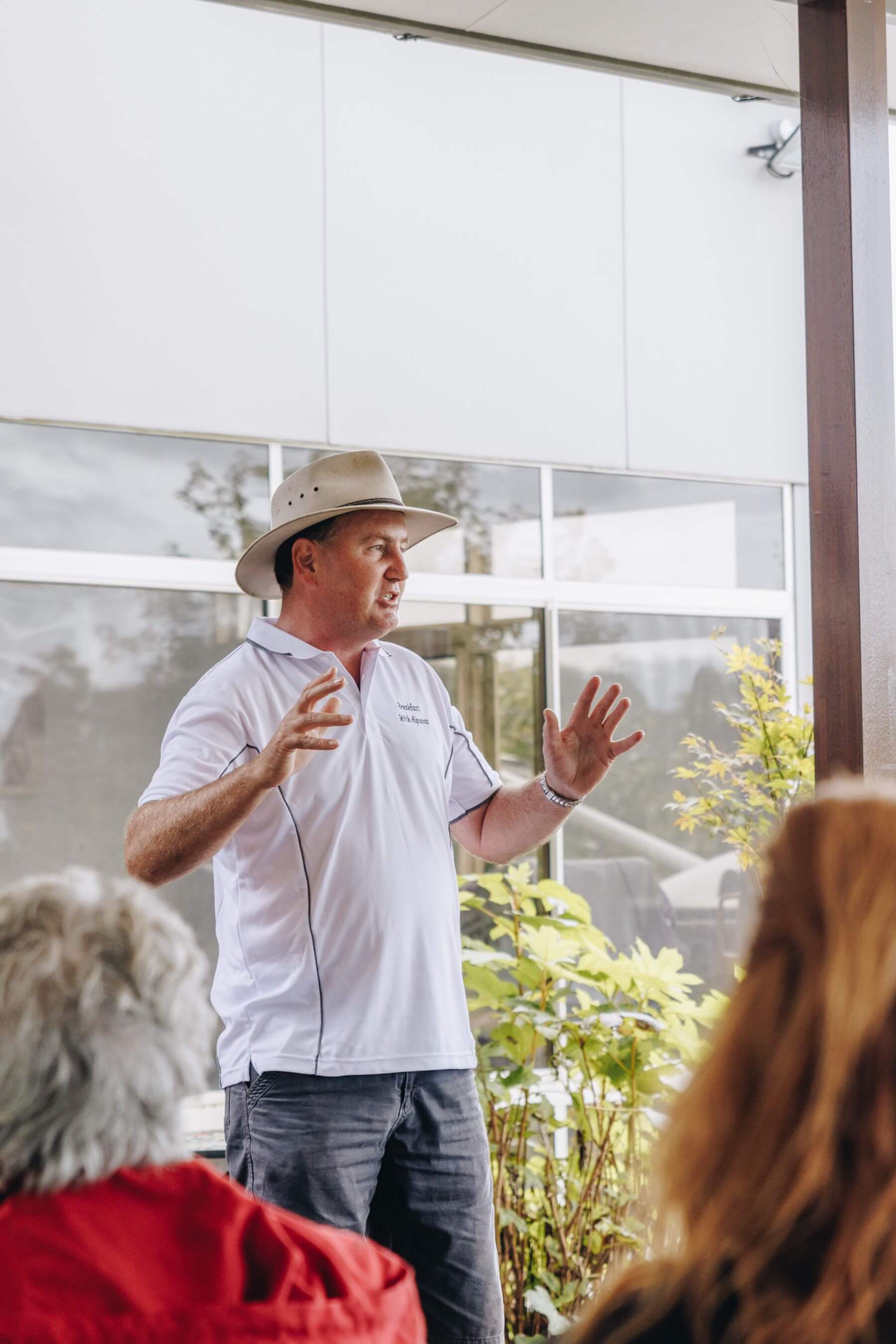 alpaca farmer talks with the tourism industry on a central coast farm