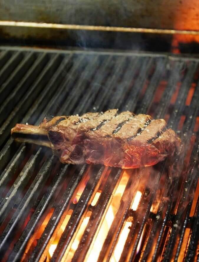 award winning juicy steak sizzling on the grill