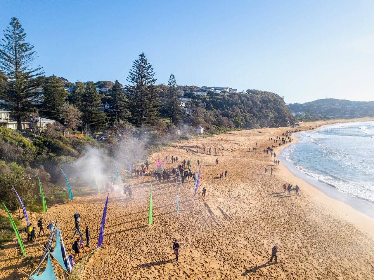 5 lands walk aerial view of beach hikers