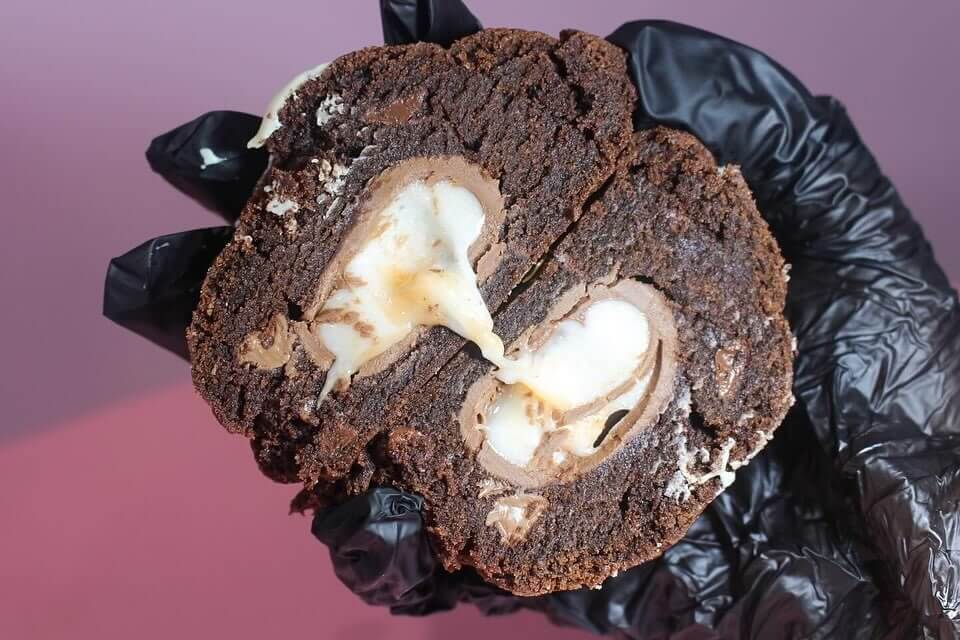 Chocolate cookie with gooey creme egg melted inside
