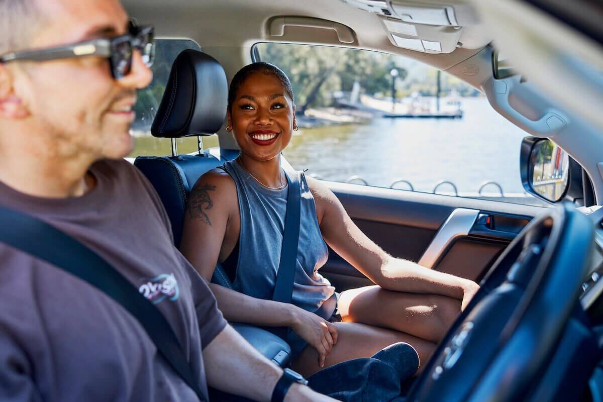 people in a car happy