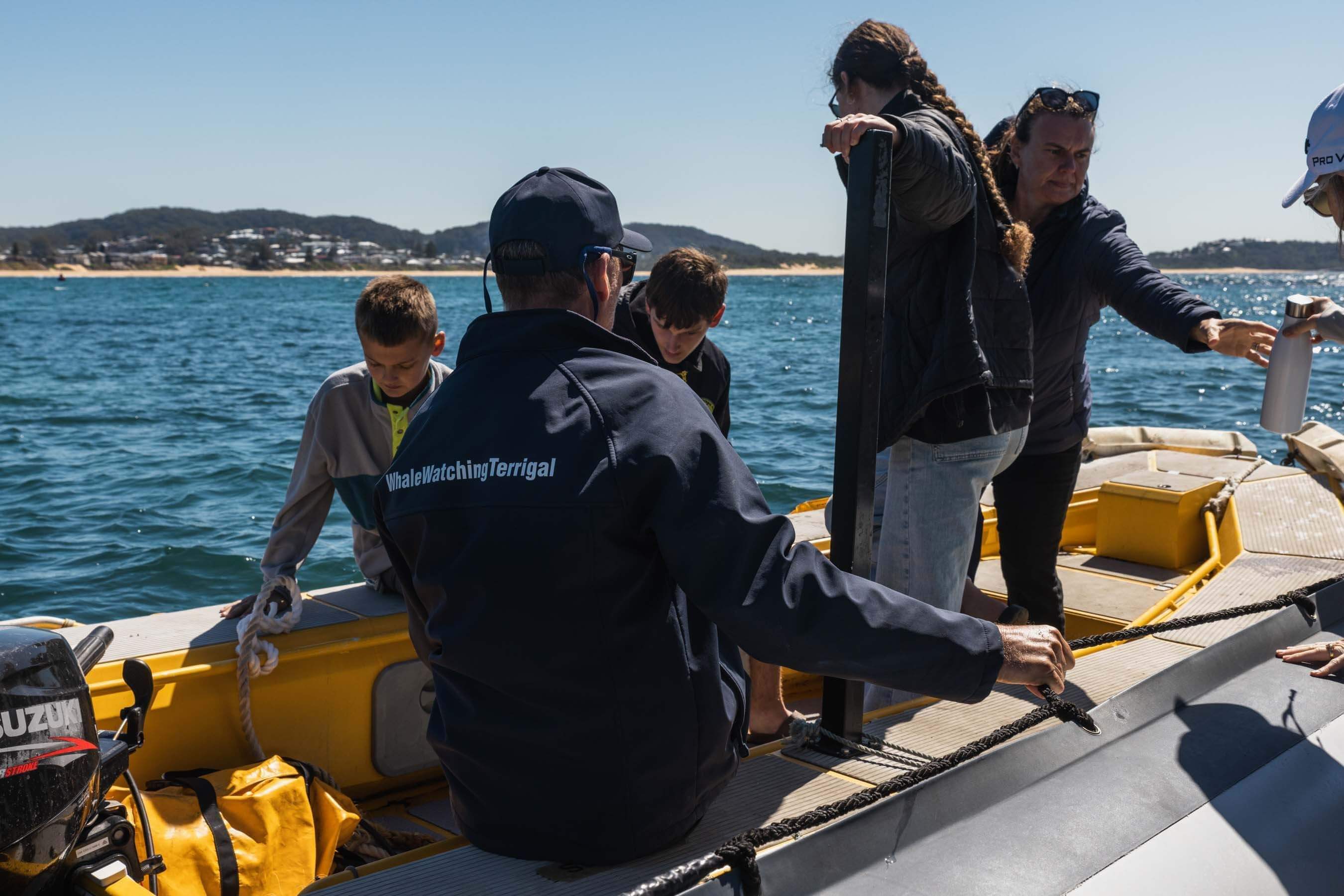 visitors in boat on the water