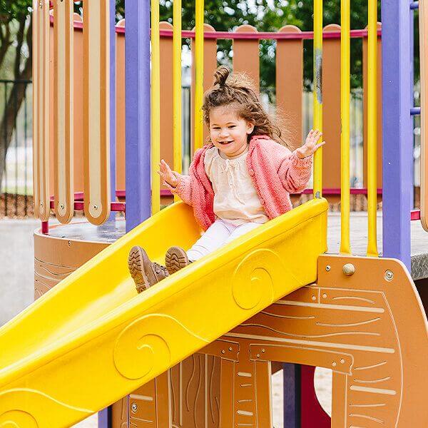 young child on slide at Peninsula Recreation Precinct Umina Beach