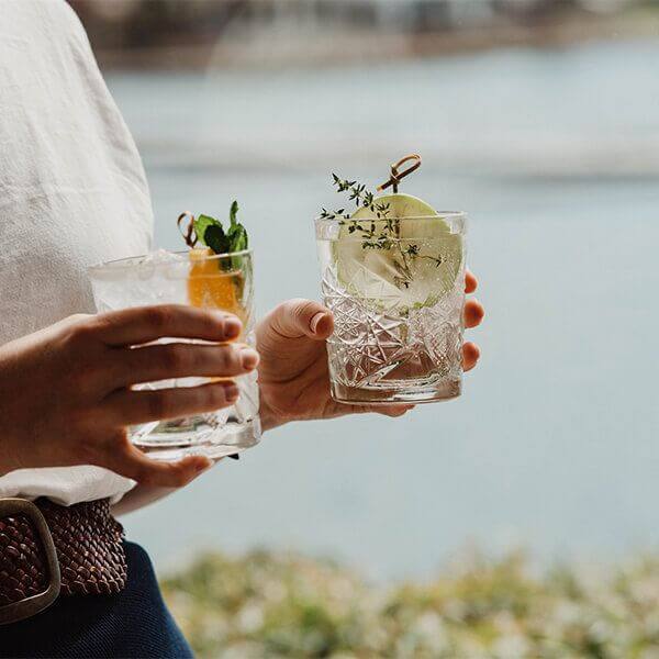 fancy cocktails in hand