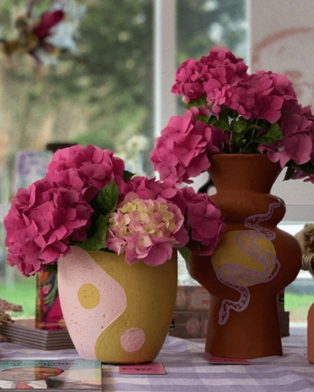 handmade vases of colourful pink flowers