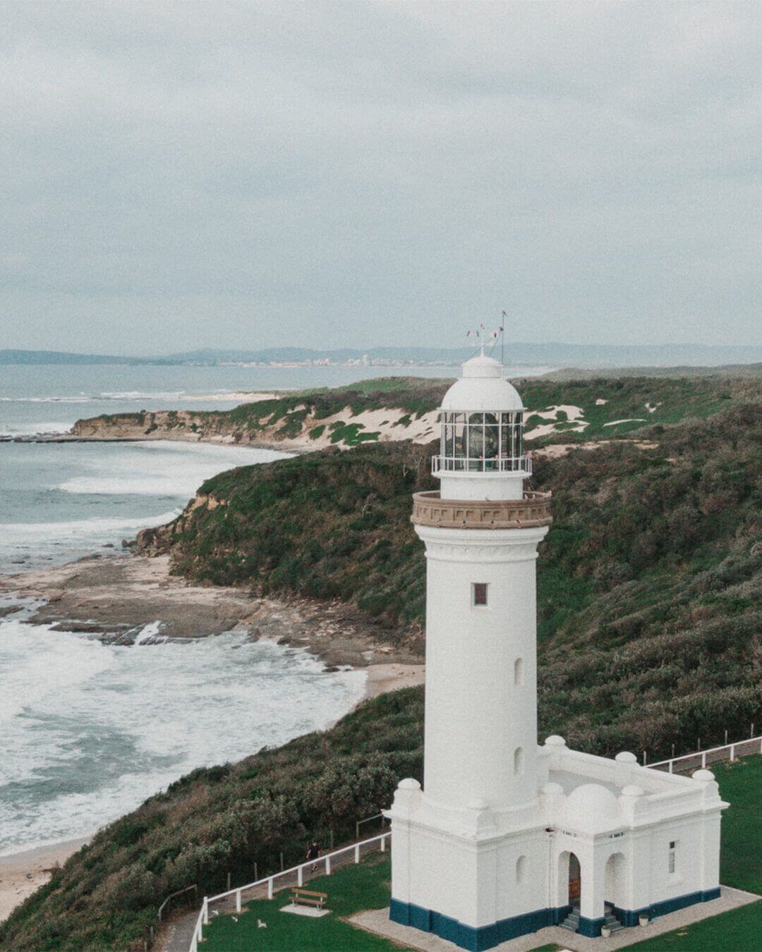 aerial of scenic coastal lighthouse