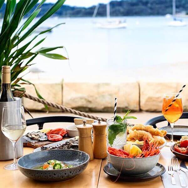 seaside feast with an aperol cocktail