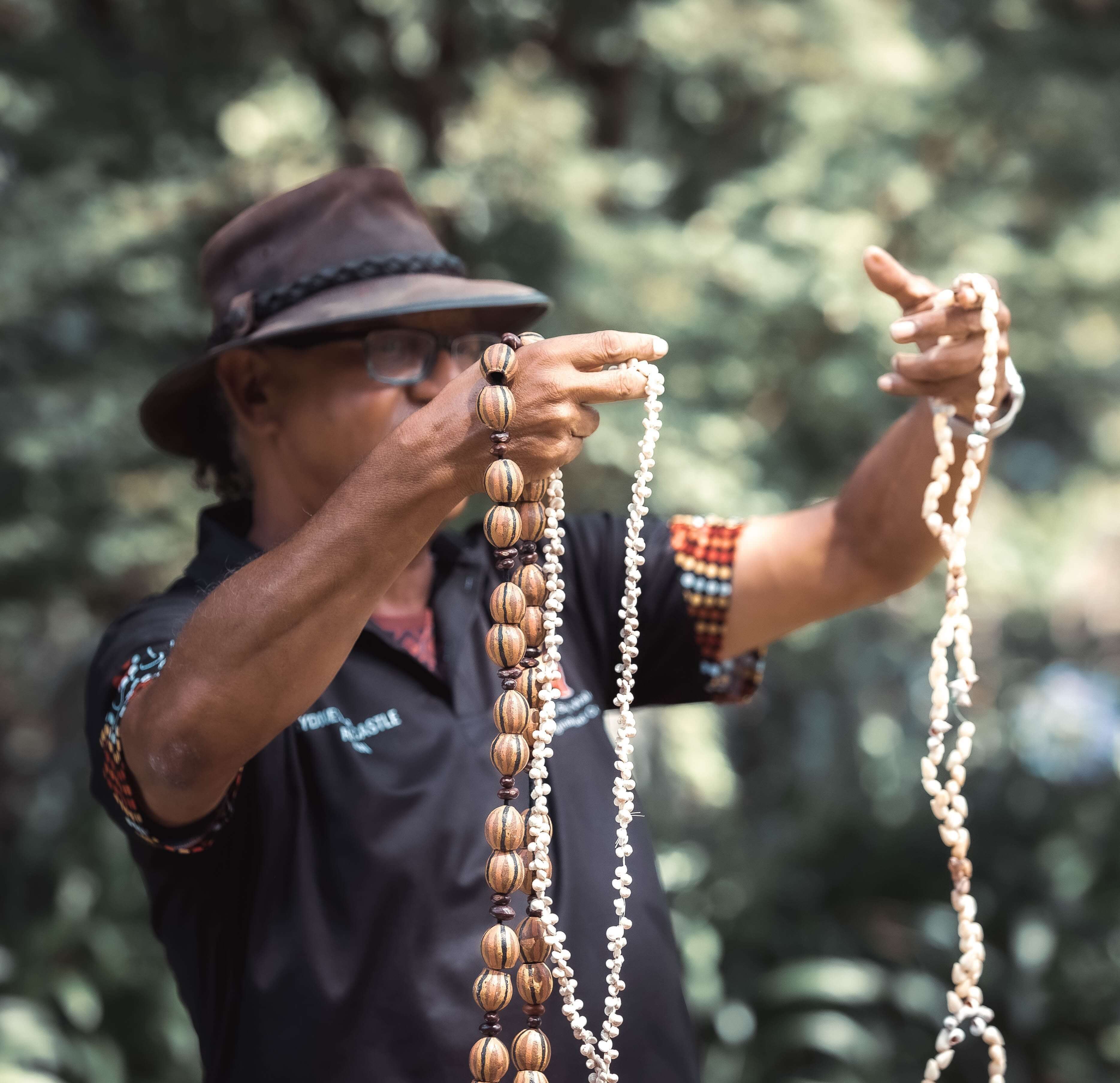 aboriginal elder with artefacts