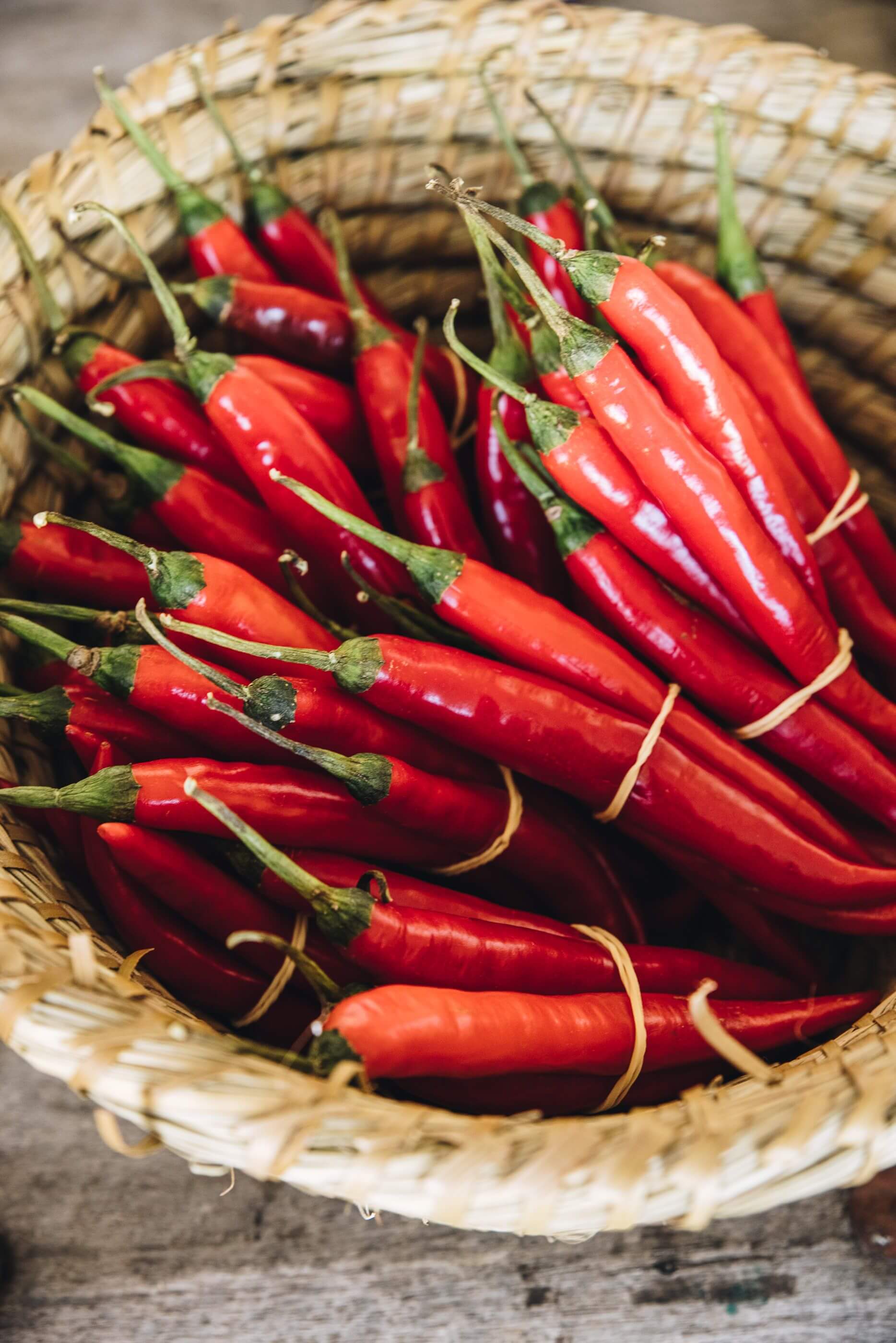 fresh red chillis in a basket