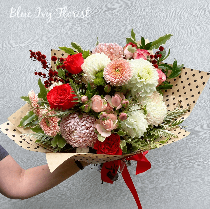 Huge bouquet of red, pink and white flowers