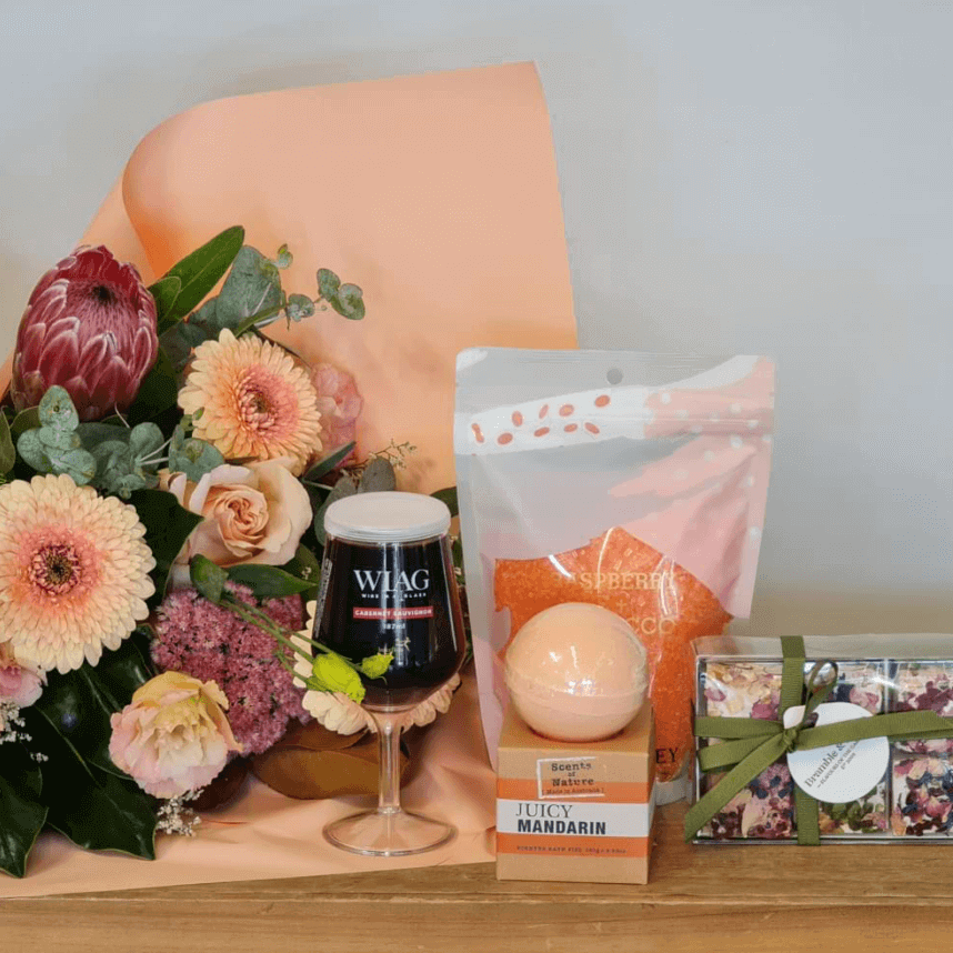Peach toned flower bouquet and gifts