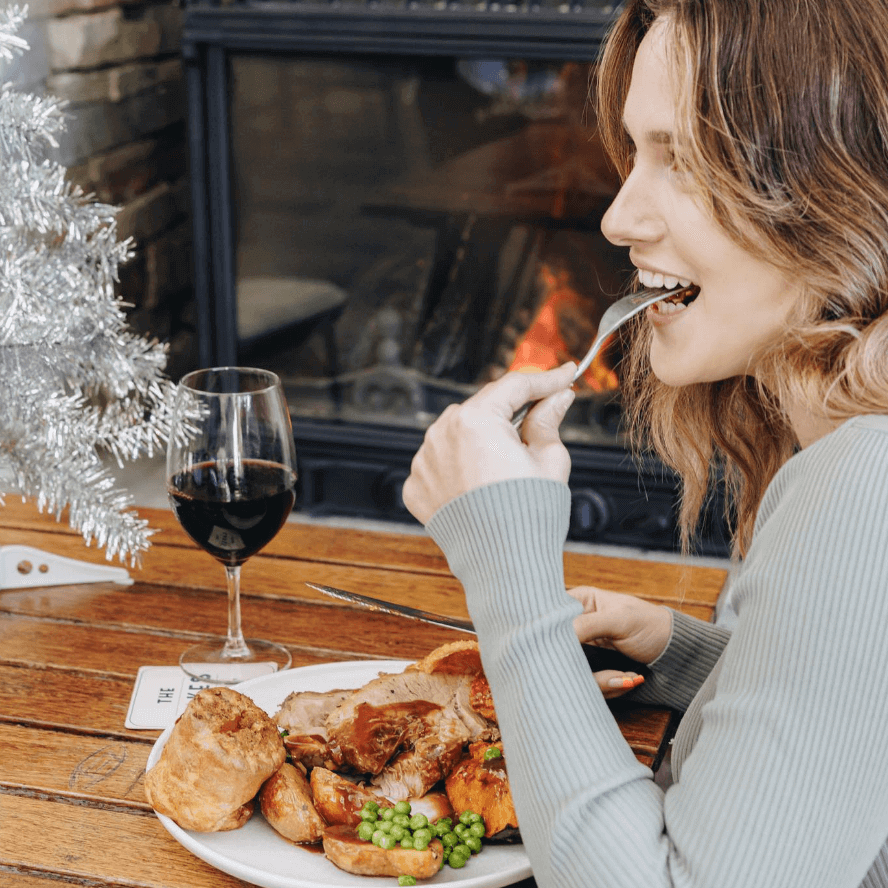women eating Christmas Roast