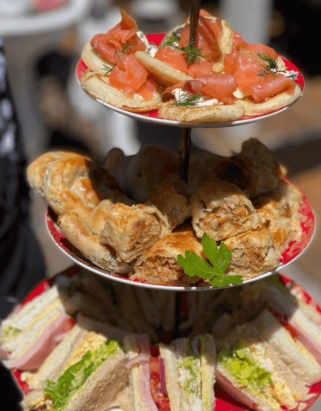 High tea with salmon and sandwiches